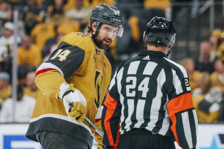 Golden Knights defenseman Nicolas Hague (14) speaks to a referee during an NHL hockey game betw ...