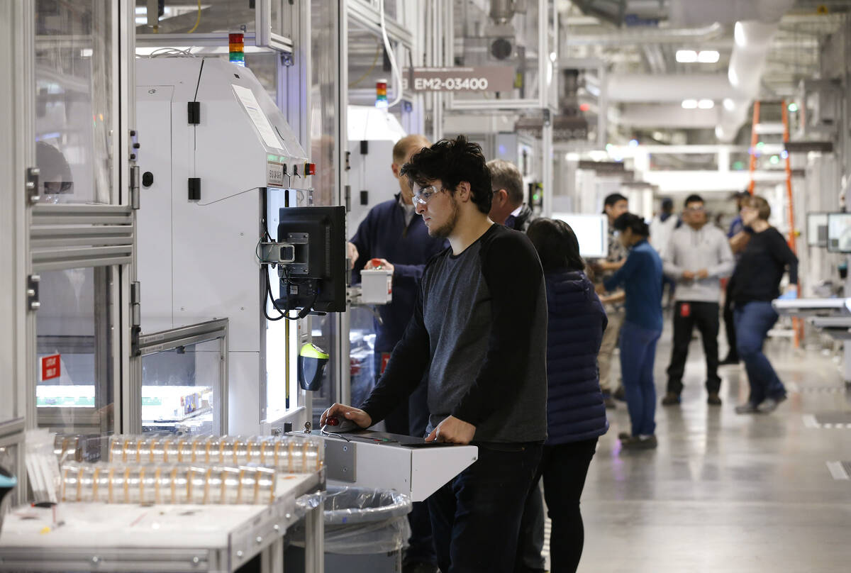 Jon Rabago works on the module line for power wall and power packs at the Tesla Gigafactory, ea ...