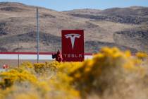 FILE - In this Oct. 13, 2018, file photo, a sign marks the entrance to the Tesla Gigafactory in ...