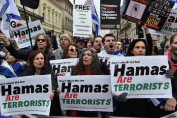 Pro-Israeli protesters take part in a demonstration along the route of the Pro-Palestinian marc ...