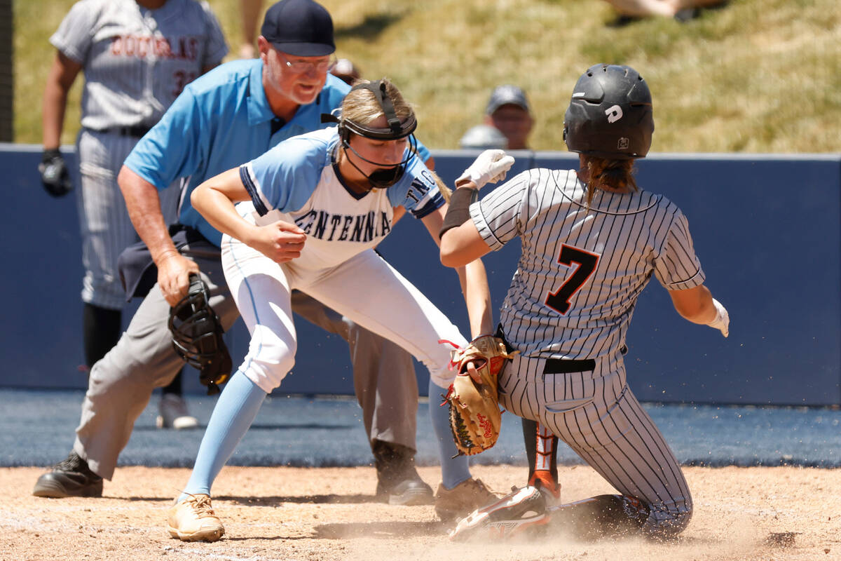 Douglas' Mercedes Covey (7) slides and scores at home as Centennial's Teagan Clemmons tries to ...