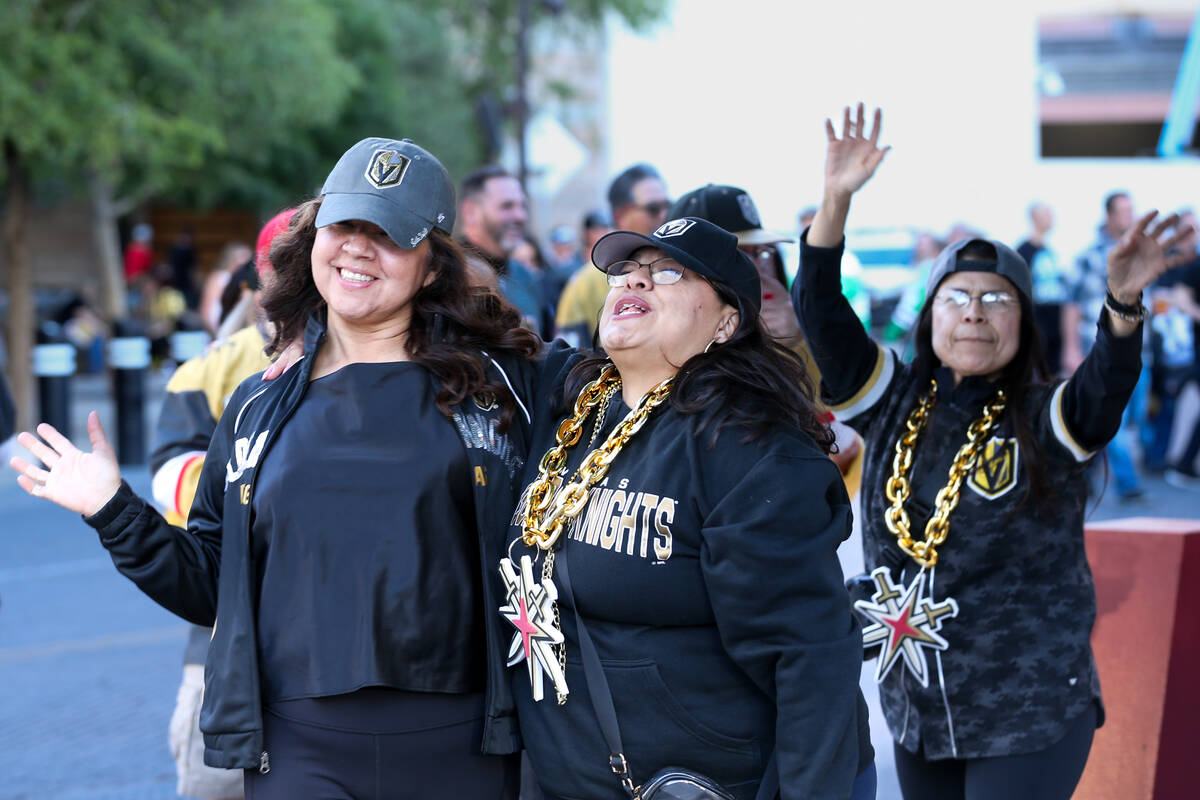 Golden Knights fans dance their way toward T-Mobile Arena before Game 3 of an NHL hockey Stanle ...