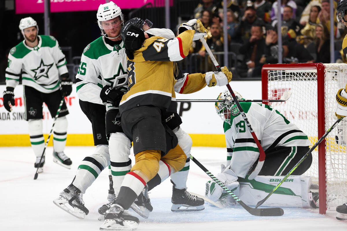 Stars defenseman Thomas Harley (55) chokeholds Golden Knights center Tomas Hertl (48) to pull h ...