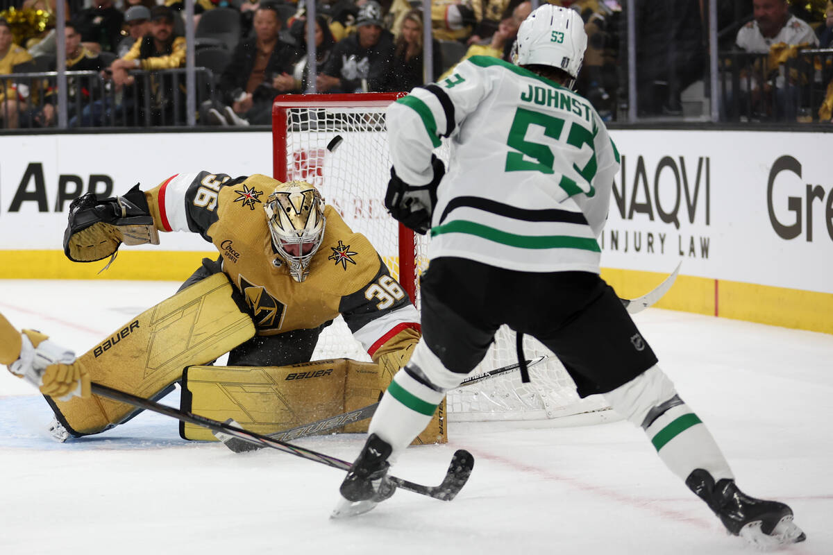 Stars center Wyatt Johnston (53) scores the game-winning goal on Golden Knights goaltender Loga ...