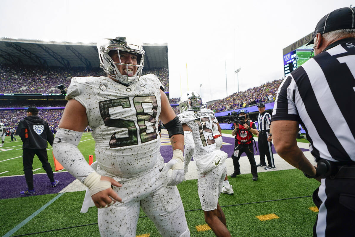 Oregon offensive lineman Jackson Powers-Johnson reacts after wide receiver Tez Johnson (15) mad ...