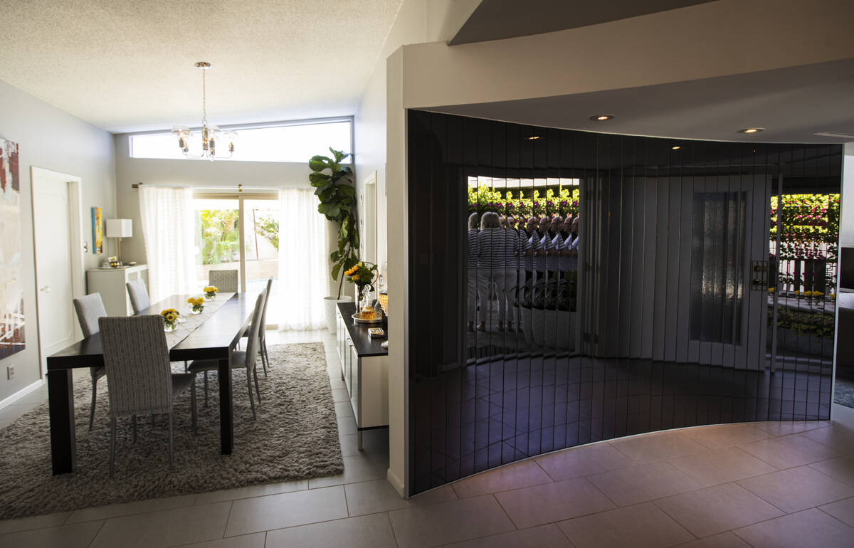 A curved mirror is seen in a 1964 home in the historic Paradise Palms neighborhood during a tou ...