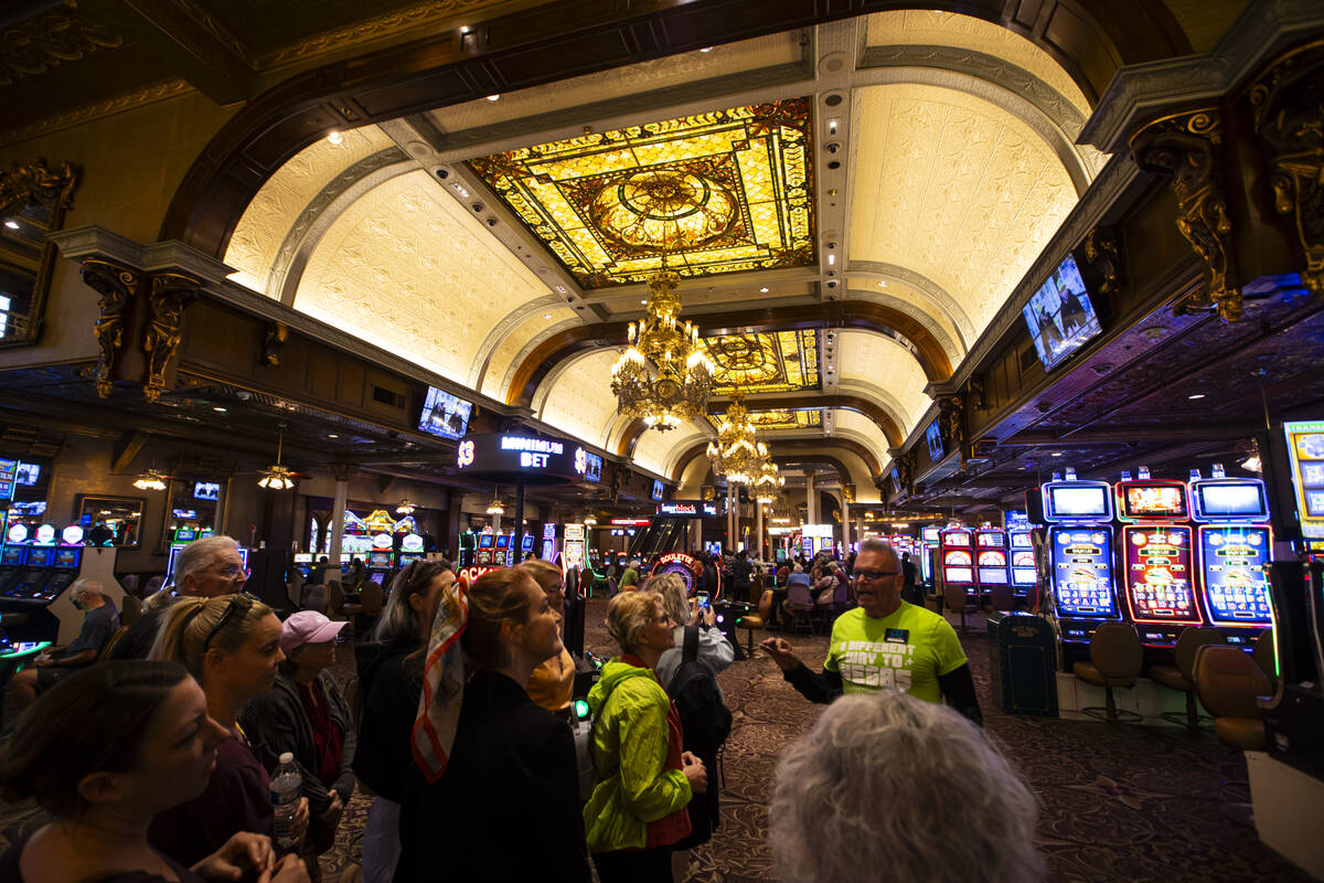 Richard Hooker, former Urban Arts Coordinator for the City of Las Vegas, right, leads a tour po ...