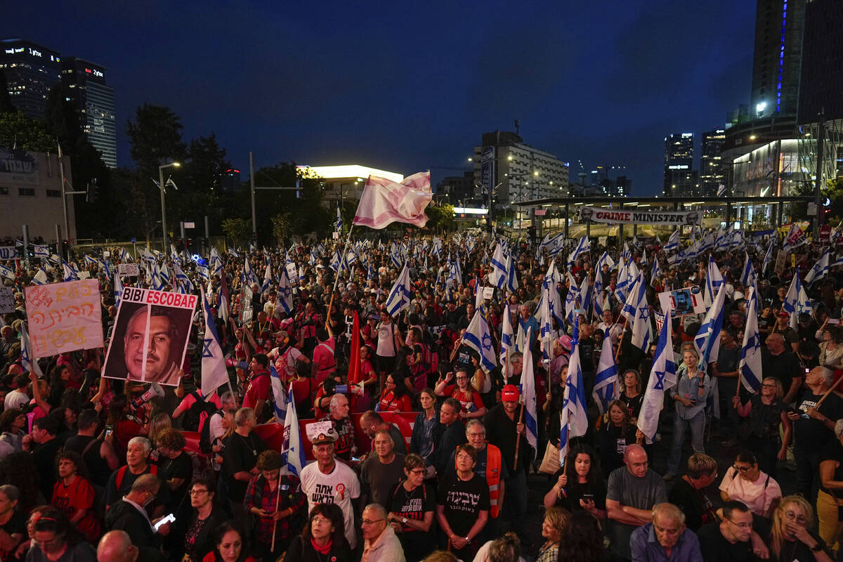 People protest against Israeli Prime Minister Benjamin Netanyahu's government and call for the ...