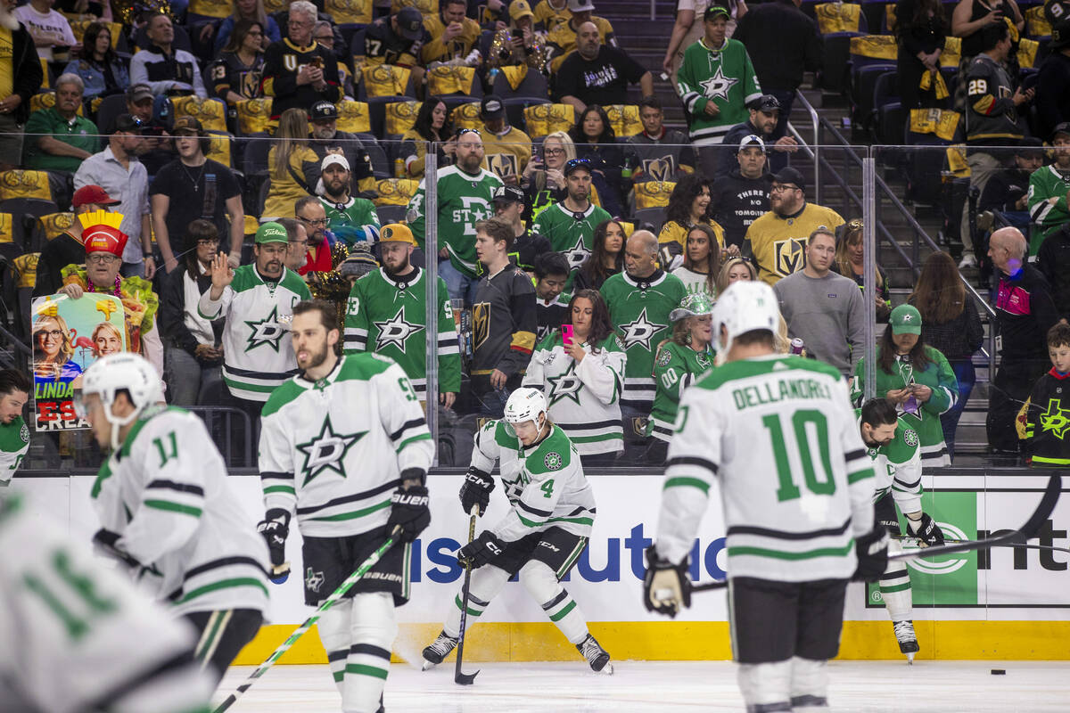 Fans watch as the Dallas Stars get loose during warm ups in Game 4 of their NHL playoff game at ...