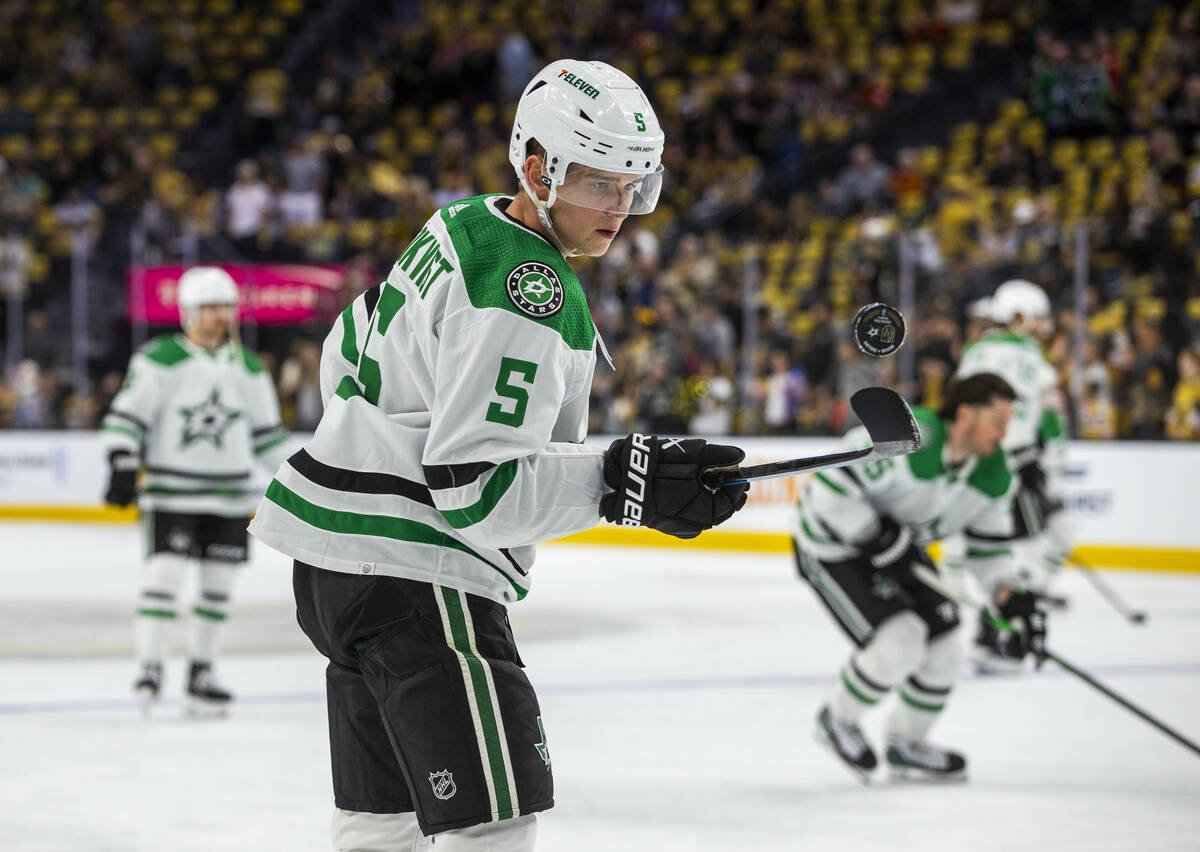 Dallas Stars defenseman Nils Lundkvist (5) flicks up a puck off his stick during warm ups in Ga ...