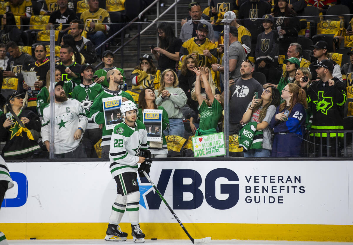 Dallas Stars center Mavrik Bourque (22) looks off after flicking up a puck to toss to the fans ...
