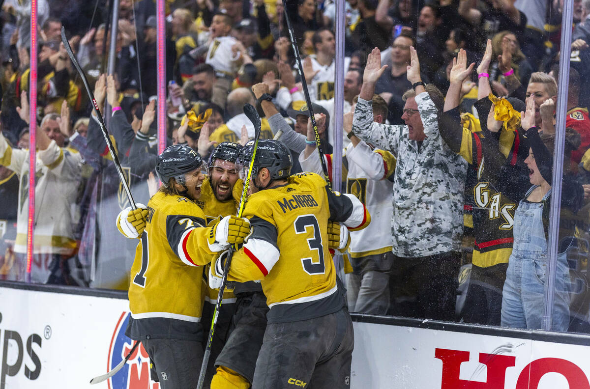 Golden Knights players celebrate a goal by right wing Michael Amadio (22) past Dallas Stars goa ...