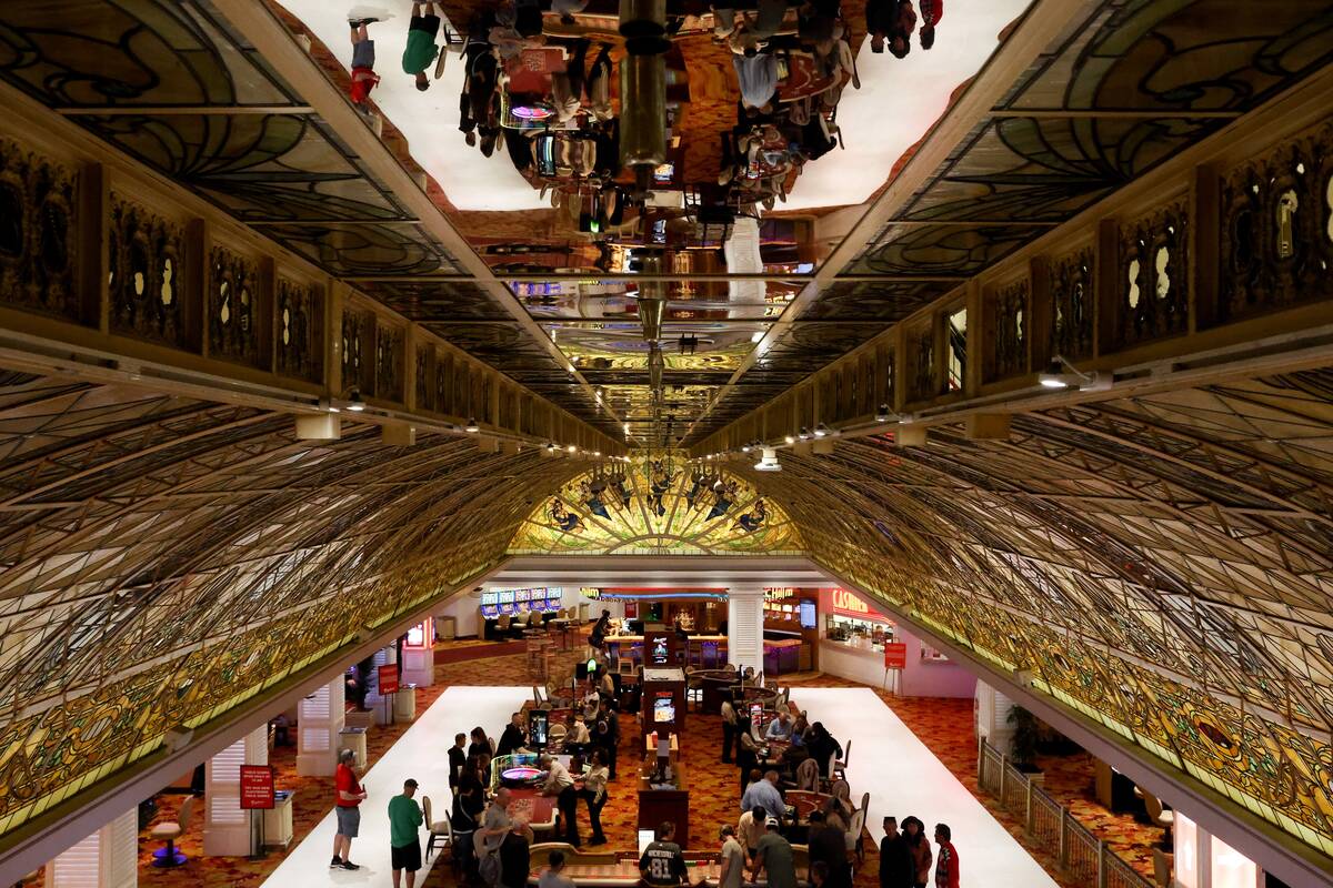 Guests gamble under the stained glass ceiling at the Tropicana Las Vegas on Friday March…