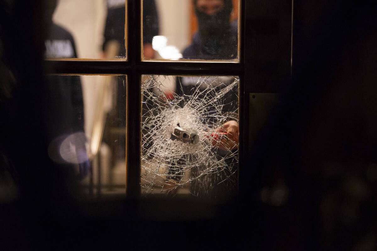 Students with the Gaza Solidarity Encampment break the doors to the entrance of Hamilton Hall a ...