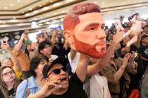 Fans cheer for Canelo Alvarez after he arrived to MGM Grand ahead of his super middleweight box ...
