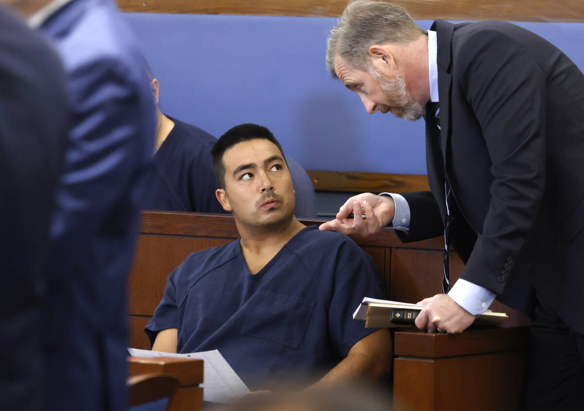 Colin Czech, a murder suspect, left, listens to David Westbrook, a public defender, during his ...