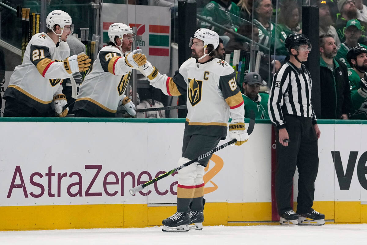Vegas Golden Knights right wing Mark Stone (61) celebrates with the bench after scoring against ...