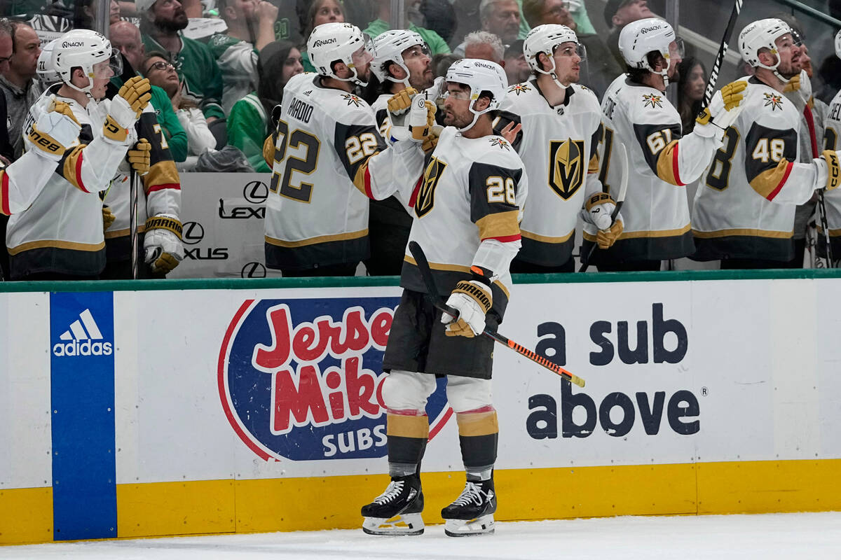 Vegas Golden Knights left wing William Carrier (28) celebrates with the bench after scoring aga ...