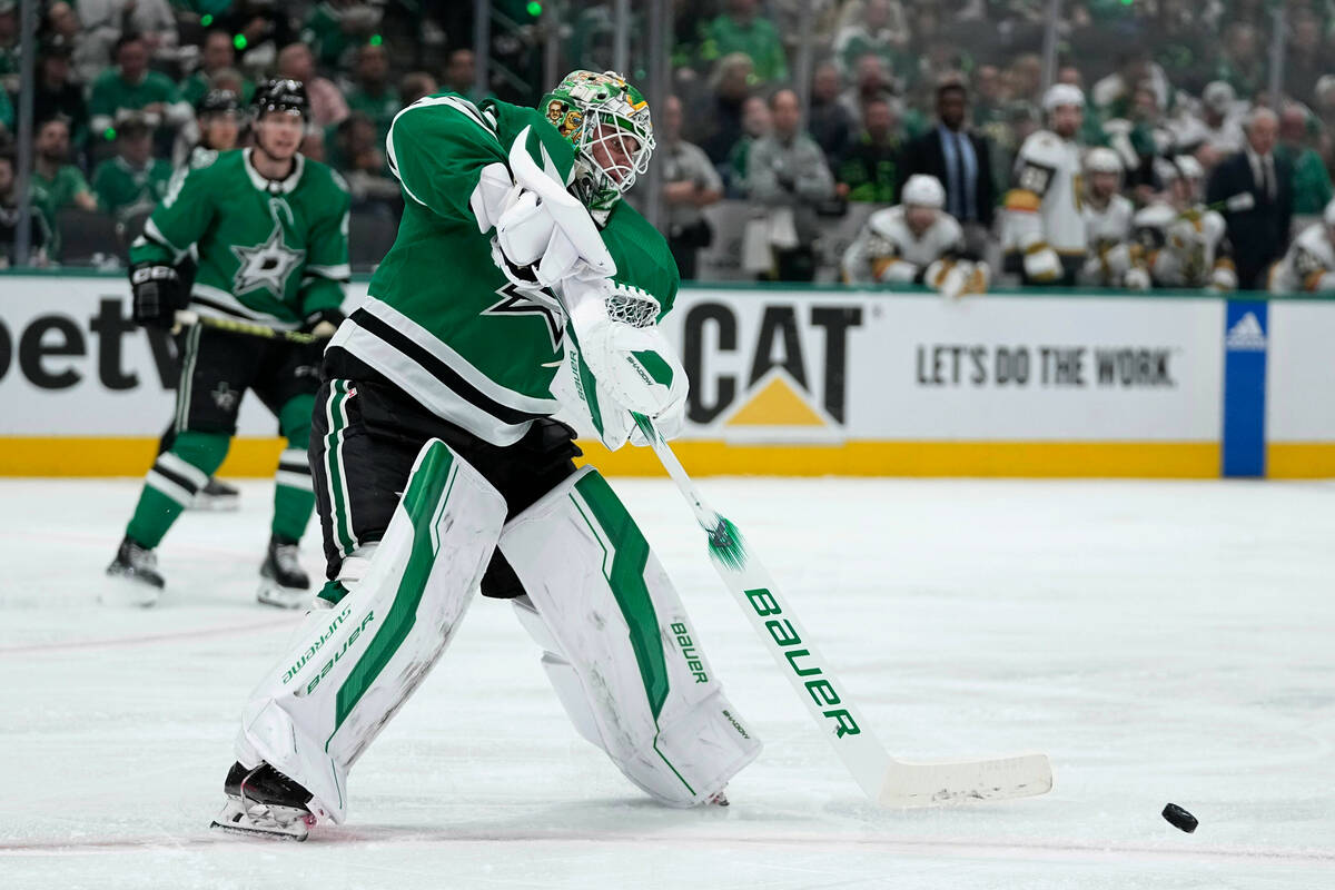 Dallas Stars goaltender Jake Oettinger clears the puck in the second period in Game 5 of an NHL ...