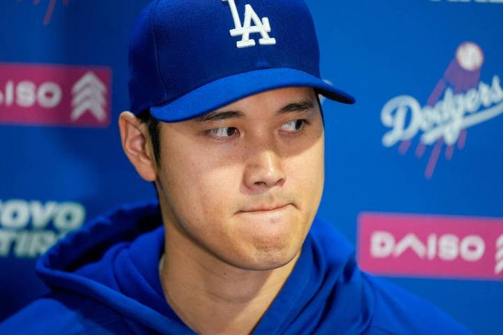 Los Angeles Dodgers' Shohei Ohtani speaks with reporters before a baseball game against the Was ...