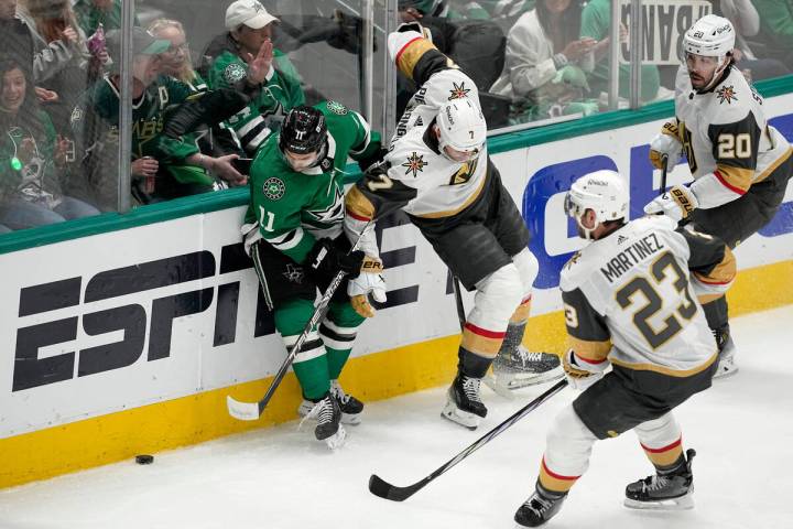 Dallas Stars center Logan Stankoven (11) works to take control of the puck against Vegas Golden ...