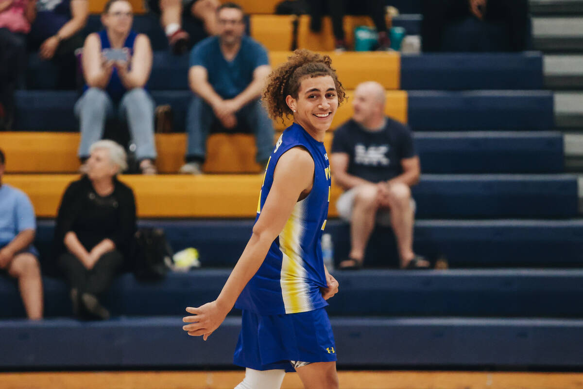 Sierra Vista outside hitter Percy Morris (7) smiles at a teammate during a boys volleyball game ...