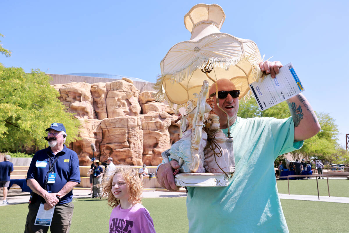 Kelly and his daughter Dorothy, 8, of Lake Elsinore, Calif. wait in line with a mid-20th centur ...