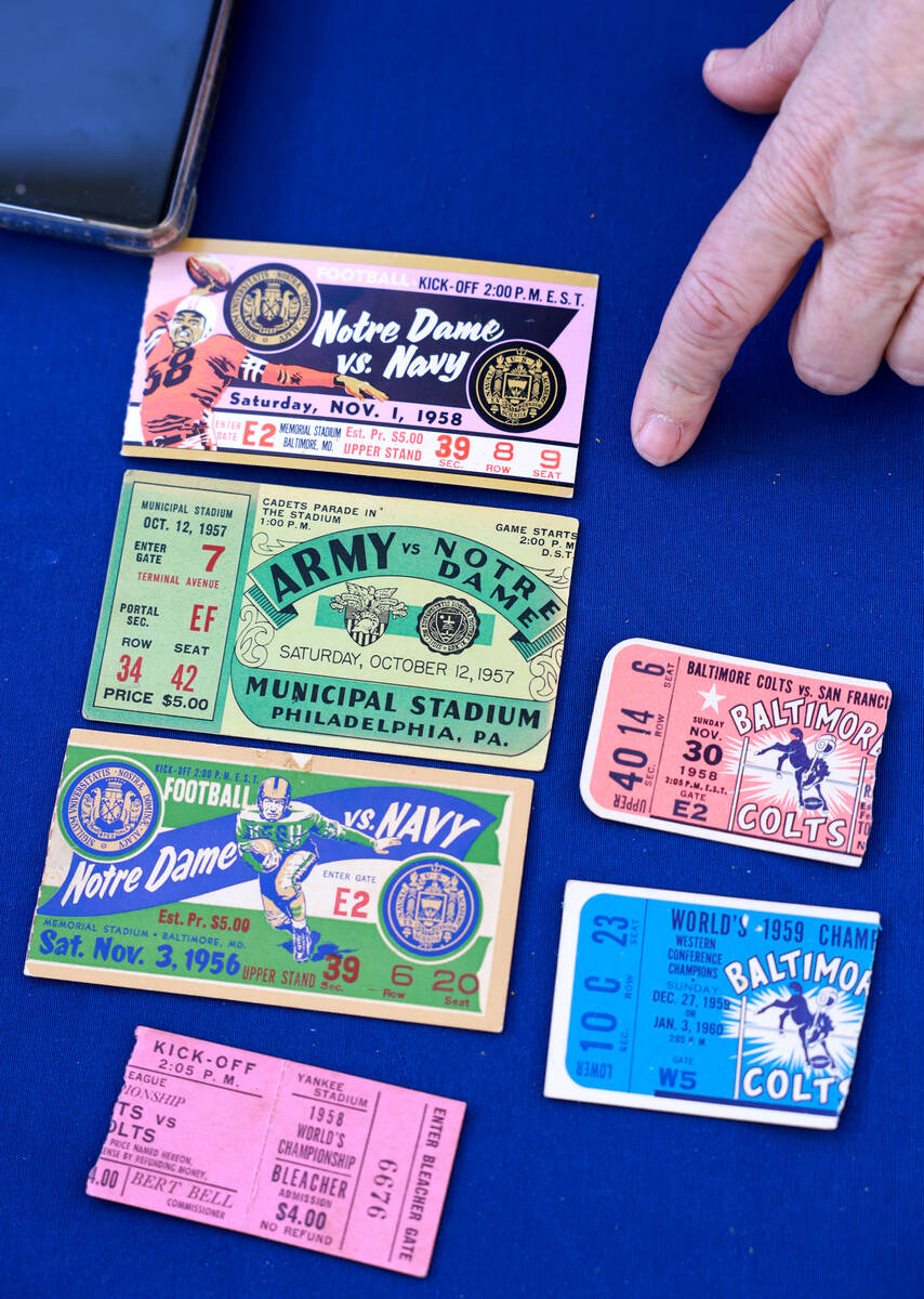 Patricia of Las Vegas shows expert Grant Zahajko her football tickets during an Antiques Roadsh ...