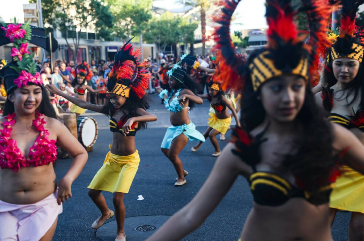 Members of the Tevakanui Polynesian Dance Group dance at the Lei Day Parade, a celebration of A ...