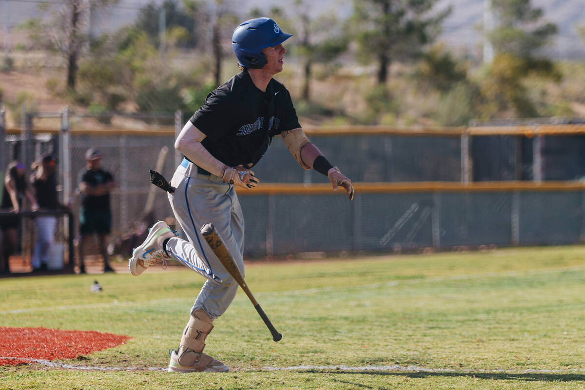Sierra Vista outfielder Brady Skinner (11) drops the bat as he runs to first base during a base ...