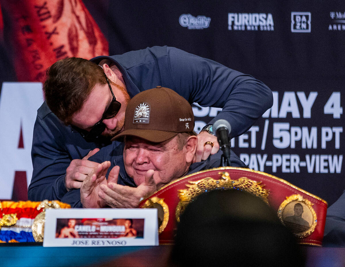 Canelo Alvarez greets Jose Reynoso as he arrives on stage during the final press conference wit ...