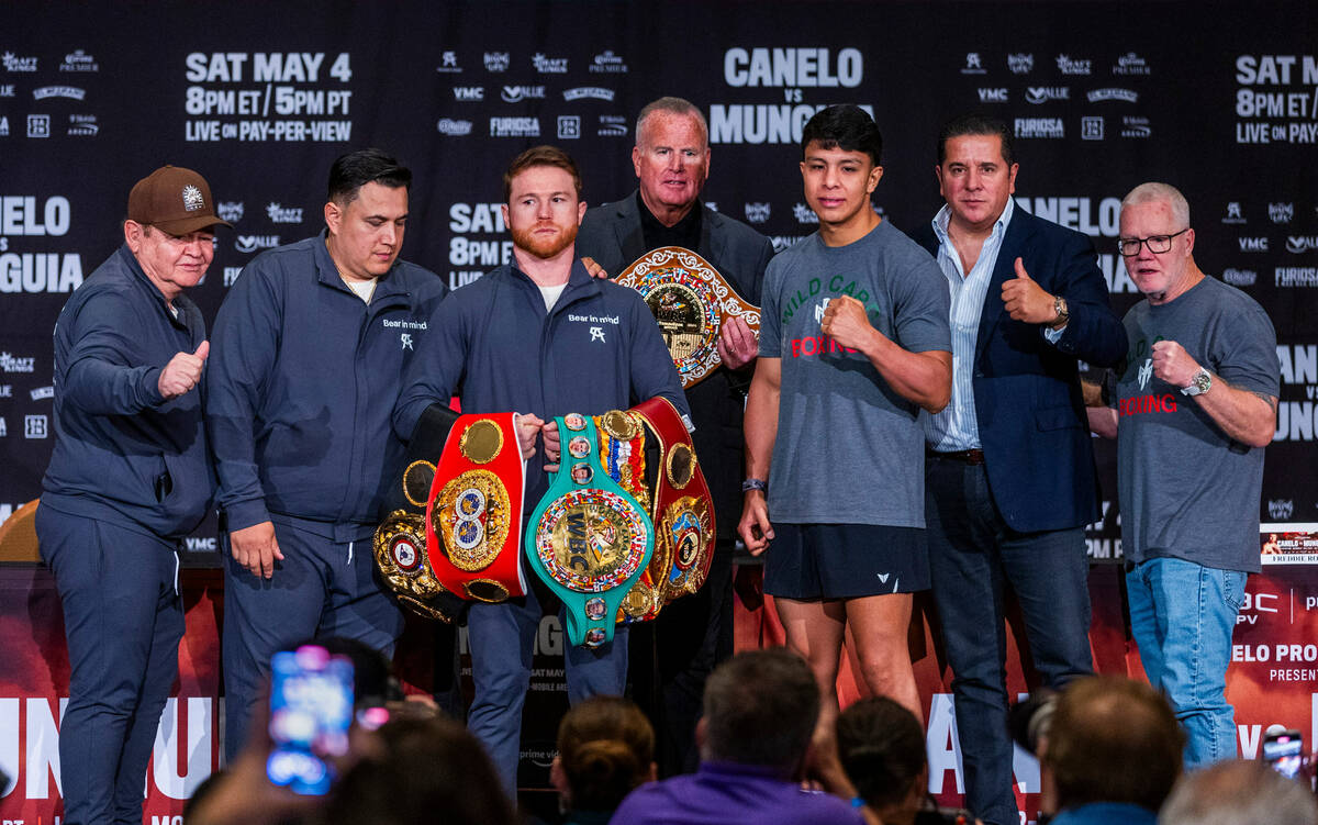 Boxer Canelo Alvarez and opponent Jaime Munguia are joined by their teams during the final pres ...