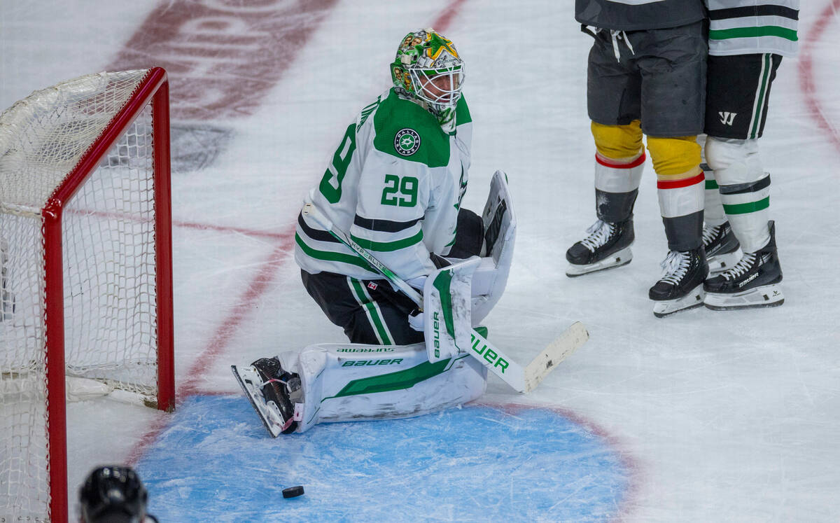 Dallas Stars goaltender Jake Oettinger (29) lets a puck get past against the Golden Knights dur ...