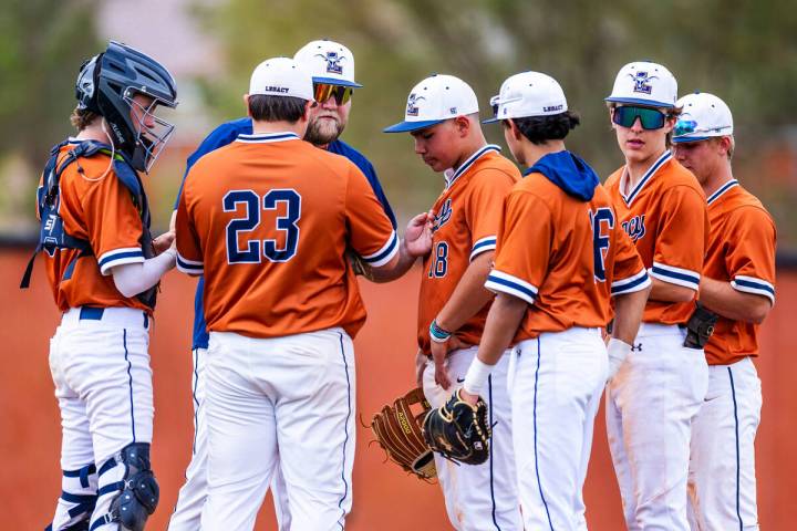 Legacy players and coach come together on the mound against Sierra Vista during the fifth innin ...