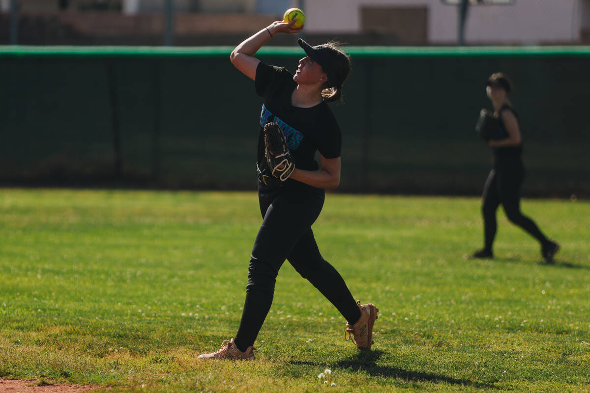 A Silverado player tosses the ball from the outfield during a softball game between Silverado a ...