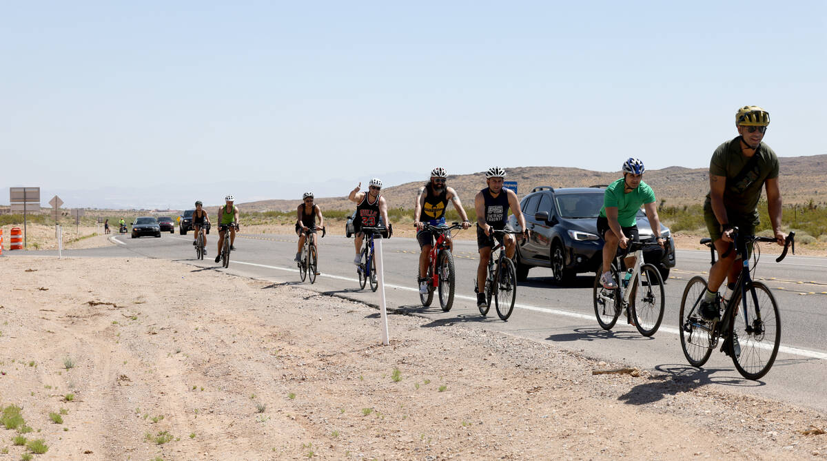 Cyclists and motorists move along State Route 159 near Calico Basin Road in Red Rock Canyon Nat ...