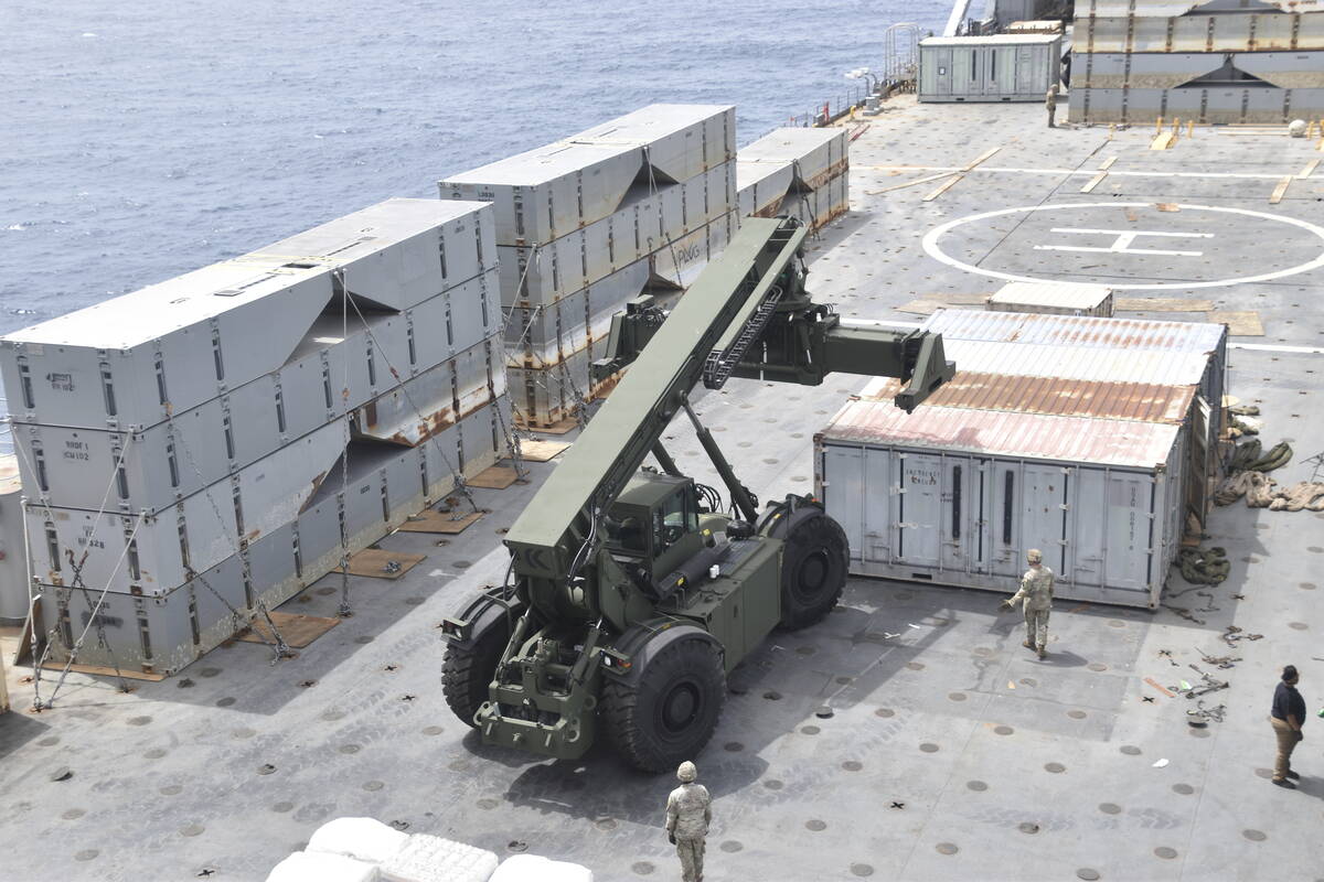 In this image provided by the U.S. Army, soldiers assigned to the 7th Transportation Brigade (E ...