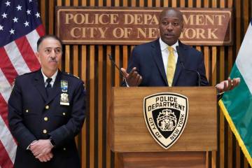 New York City Police Dept. Deputy Commissioner of Public Information Tarik Sheppard, right, is ...