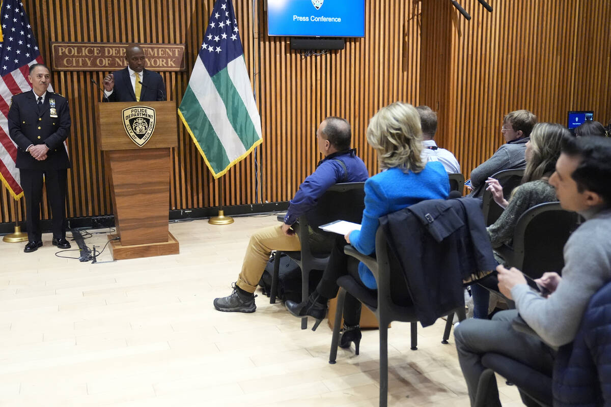 New York City Police Dept. Deputy Commissioner of Public Information Tarik Sheppard, center rig ...