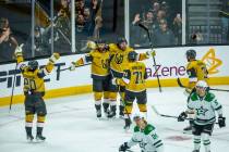 Golden Knights right wing Mark Stone (61) is celebrated with teammates for an empty net goal ag ...