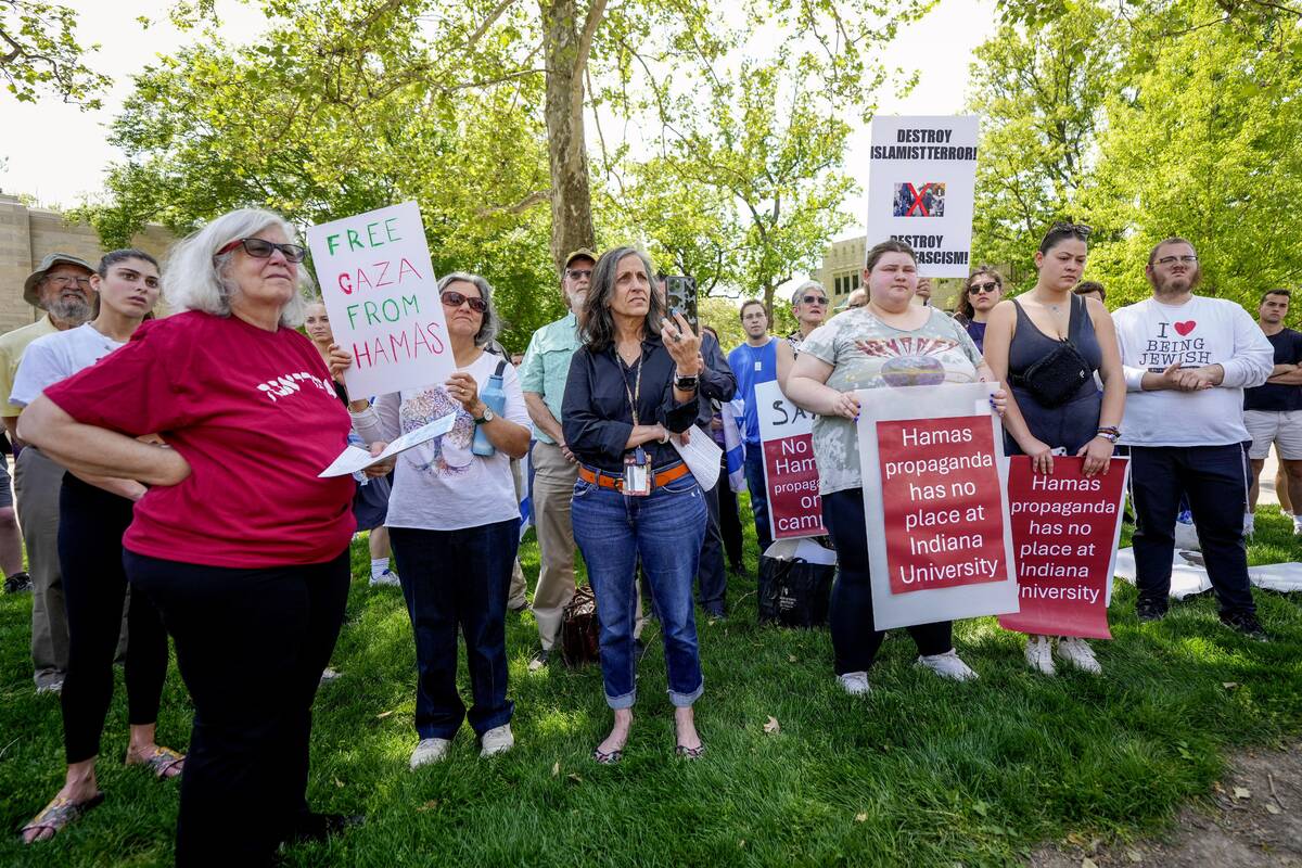 Protesters listen during a pro-Israel rally at Indiana University in Bloomington, Ind., Thursda ...