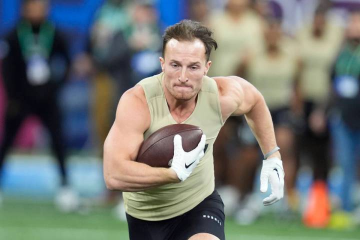 New Hampshire running back Dylan Laube runs a drill at the NFL football scouting combine, Satur ...