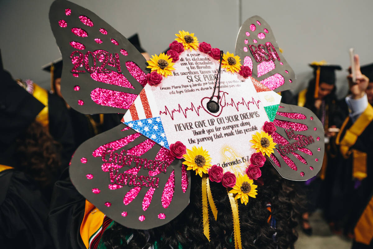 A graduate’s decorated mortarboard is seen shortly before the Nevada State University co ...