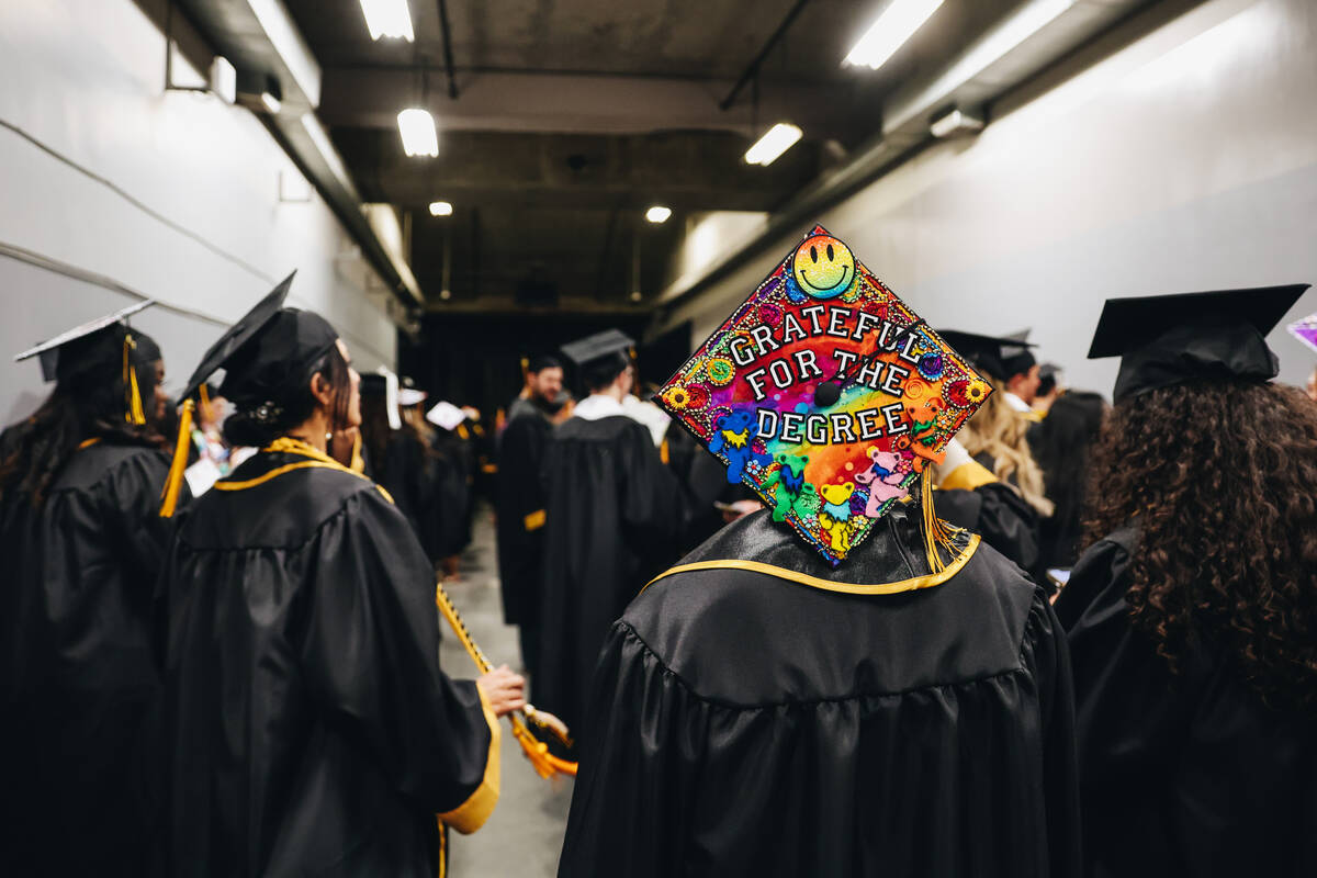 A graduate’s decorated mortarboard is seen shortly before the Nevada State University co ...