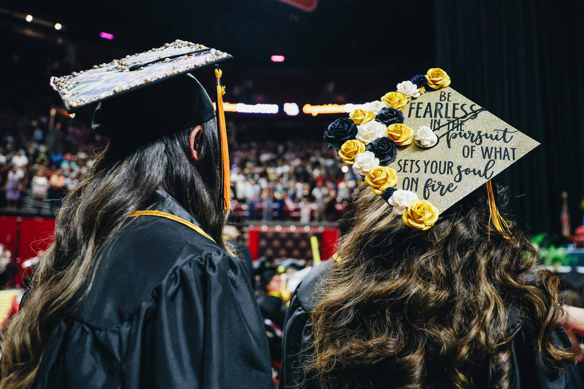 Graduates participate in the Nevada State University commencement ceremony at the Thomas & ...