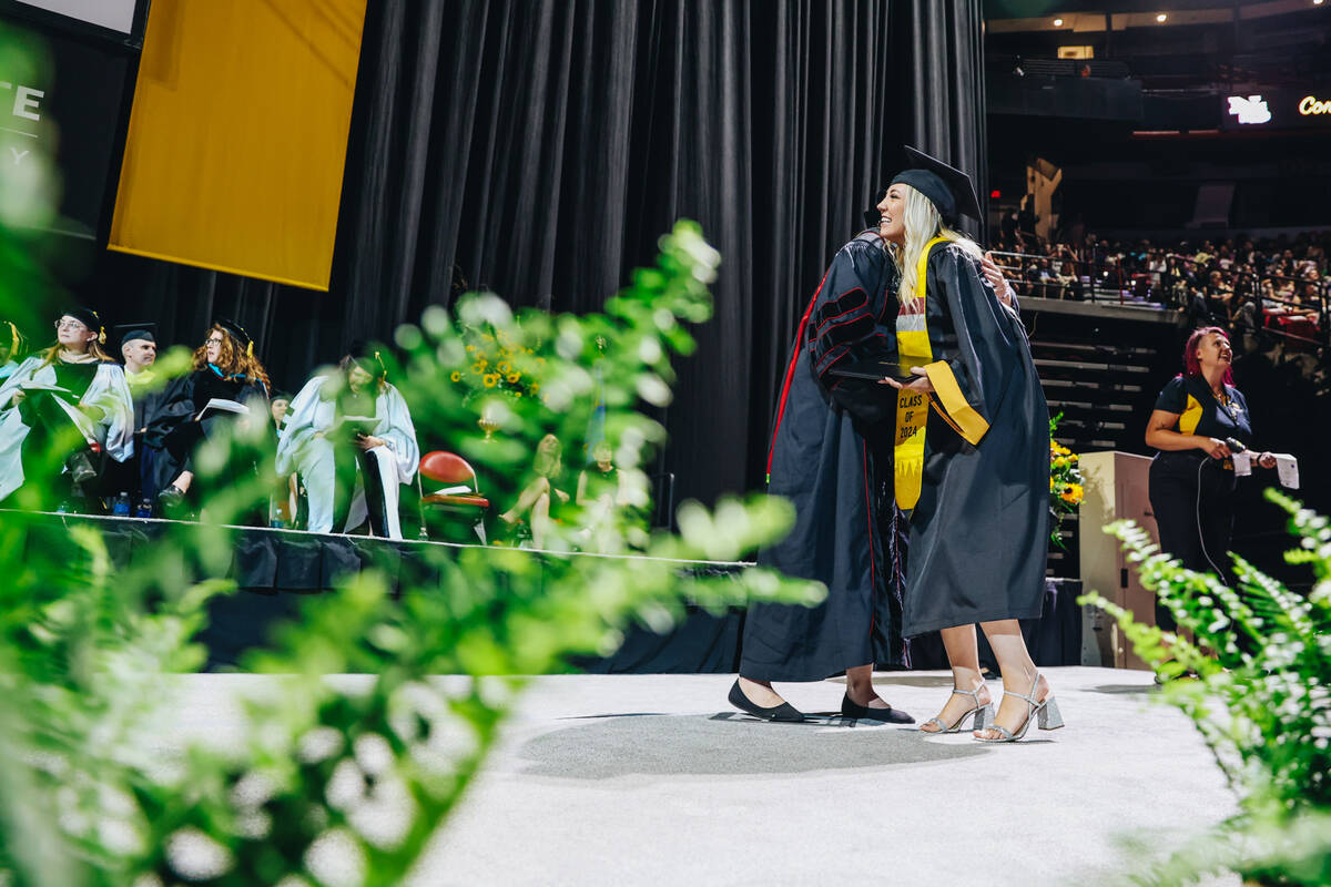 Graduates participate in the Nevada State University commencement ceremony at Thomas & Mack ...