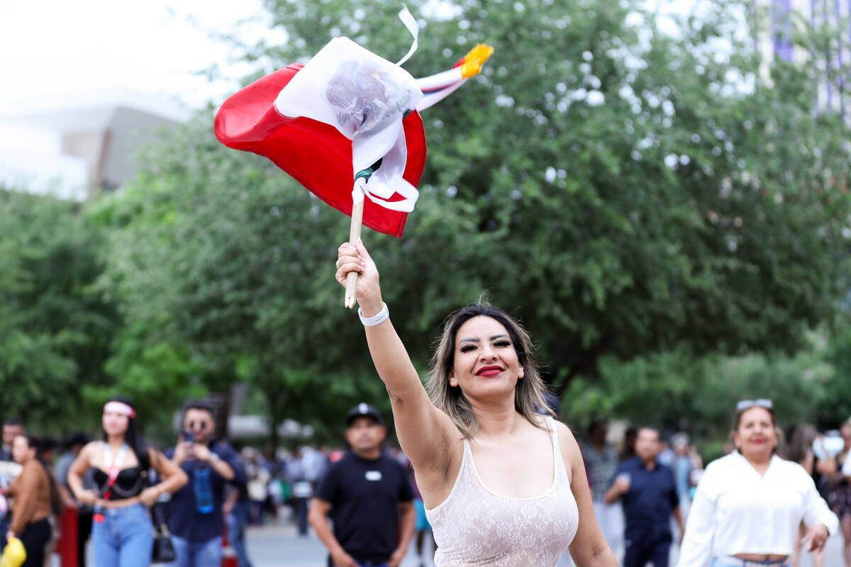 A Jaime Munguía fan waves the Mexican flag while walking into T-Mobile Arena for his undis ...