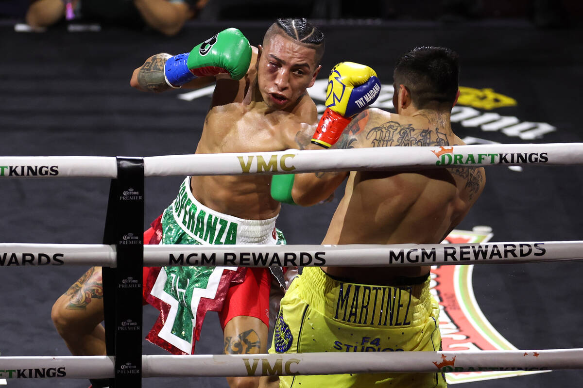 Mario Barrios gets a hit on Fabián Maidana in a WBC interim world welterweight title boxin ...