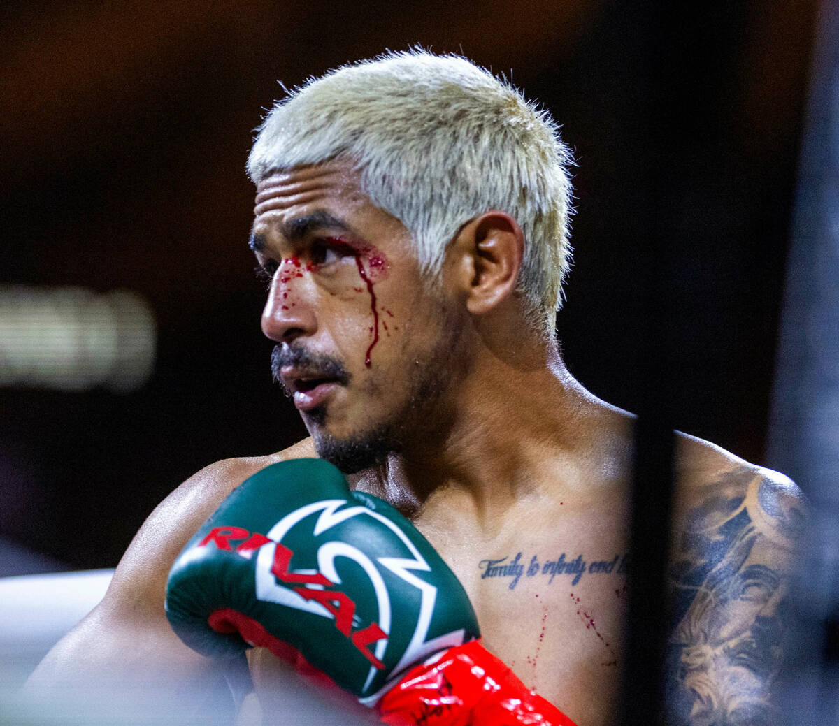 Featherweight Jessie Magdaleno is bleeding from a head butt by Brandon Figueroa during the firs ...