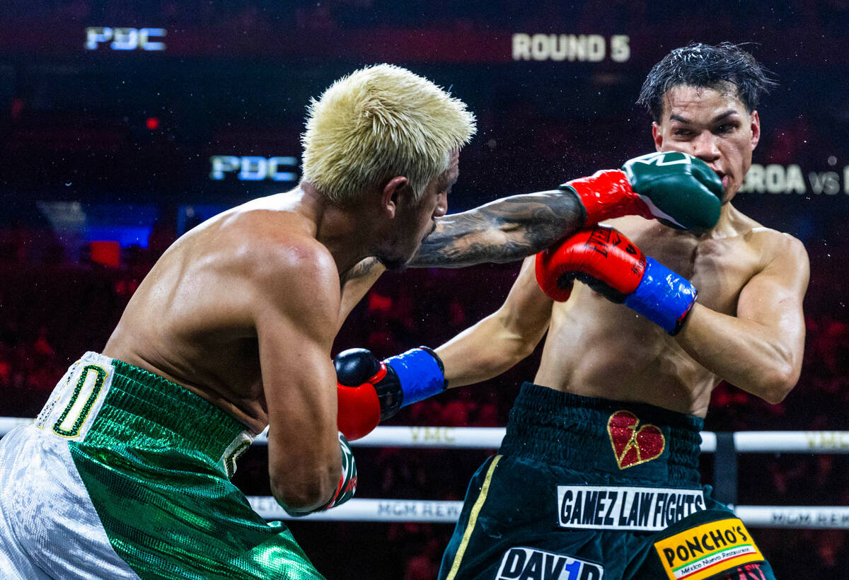 Featherweight Jessie Magdaleno connects with a shot to the chin of Brandon Figueroa during the ...